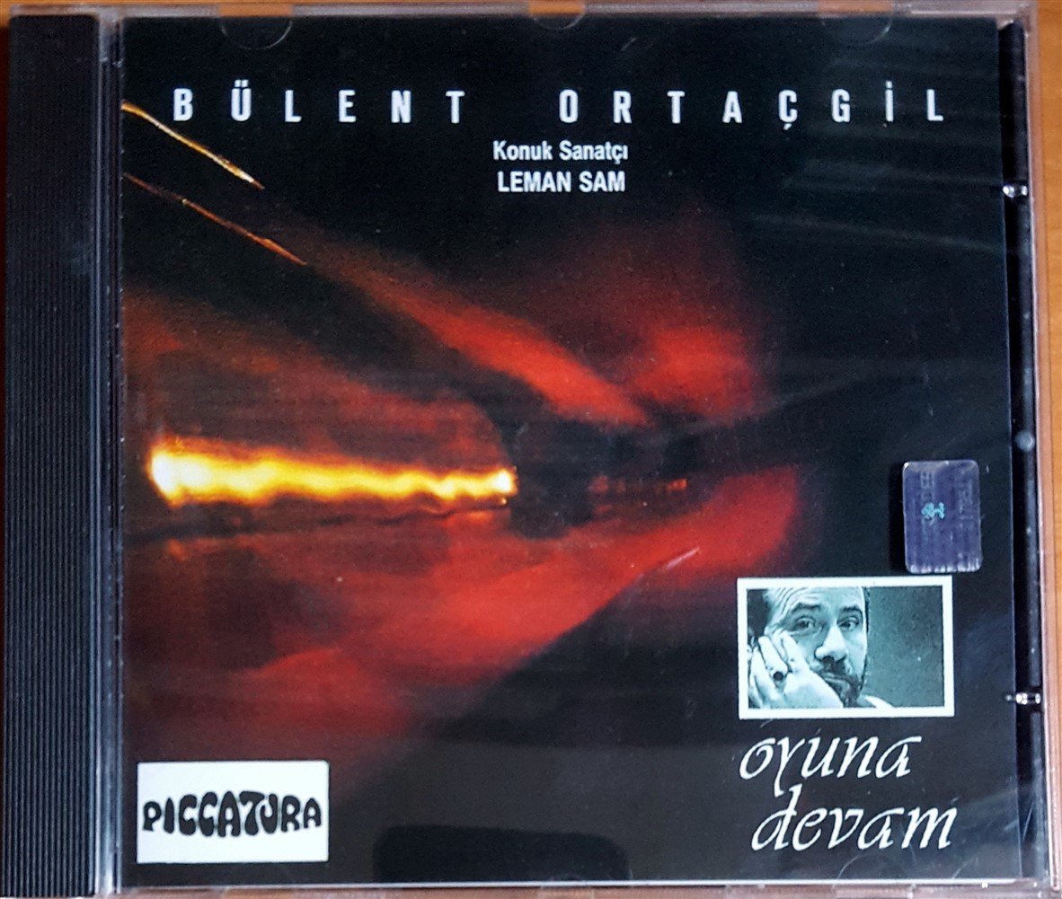 BÜLENT ORTAÇGİL - OYUNA DEVAM / KONUK SANATÇI LEMAN SAM (1996) PICCATURA CD 2.EL