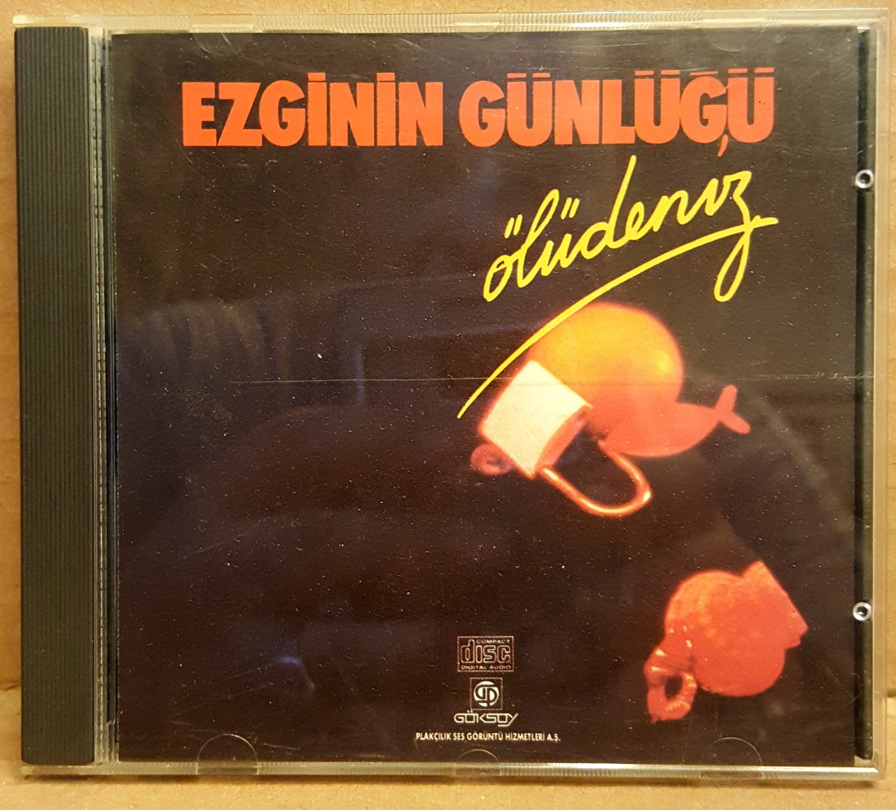 EZGİNİN GÜNLÜĞÜ - ÖLÜDENİZ (1990) - CD ESKİ SARI PLASTİK BANDROL GÖKSOY PLAK 2.EL