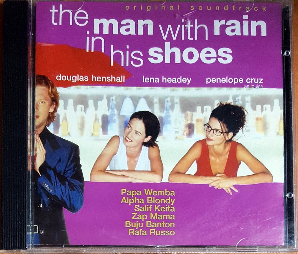 THE MAN WITH THE RAIN IN HIS SHOES SOUNDTRACK / PAPA WEMBA, ALPHA BLONDY, SALIF KEITA, ZAP MAMA, BUJU BANTON, RAFA RUSSO (1998) VIRGIN CD 2.EL