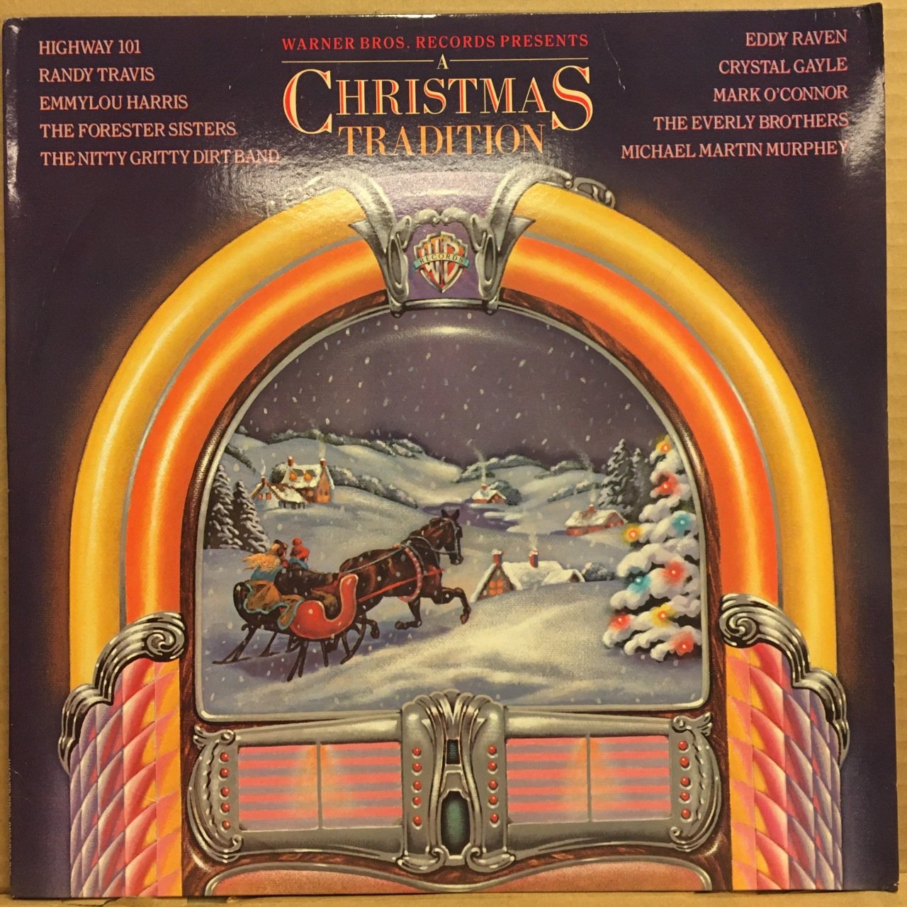 A CHRISTMAS TRADITION RANDY TRAVIS, EMMYLOU HARRIS, CRYSTAL GAYLE.. (1987) 2.EL PLAK