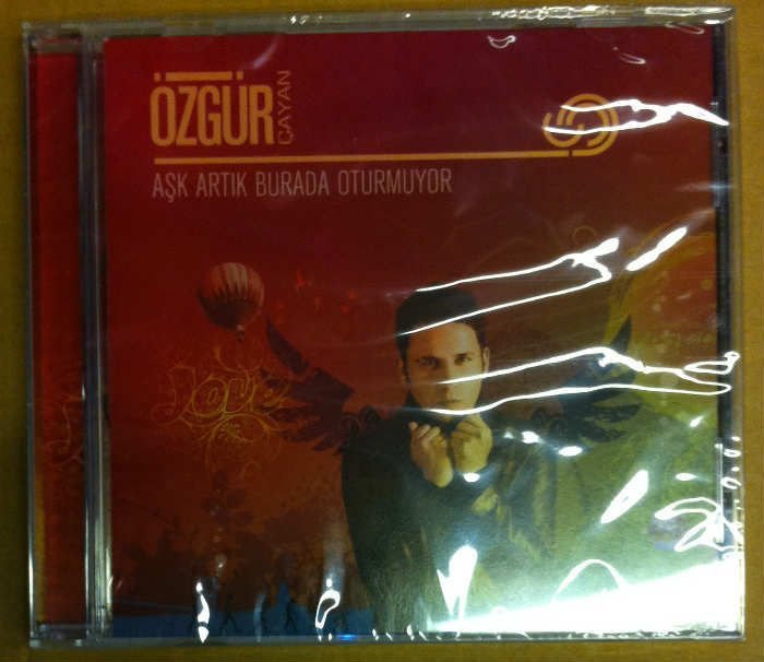 ÖZGÜR ÇAYAN AŞK ARTIK BURADA OTURMUYOR CD SIFIR