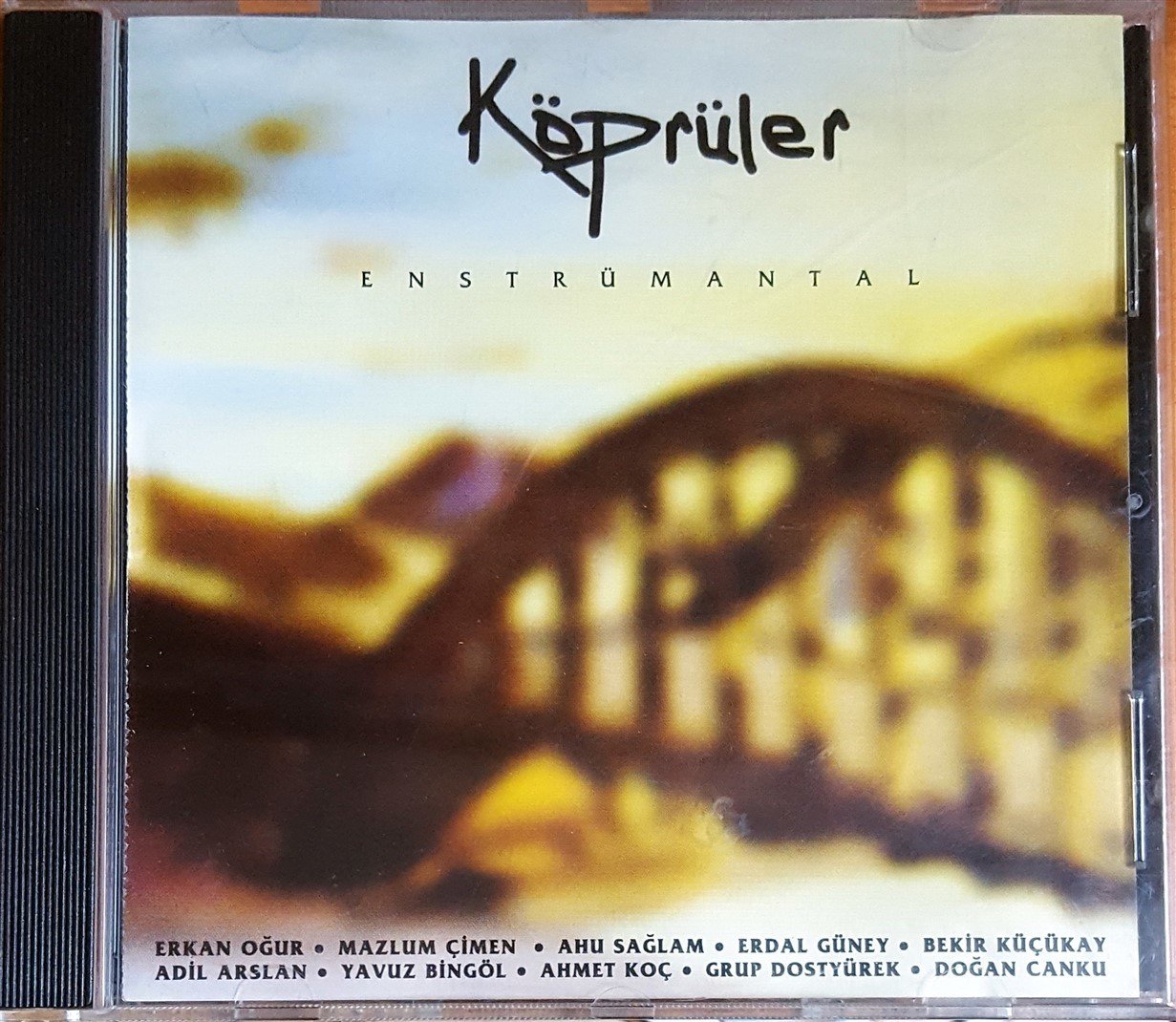 KÖPRÜLER - ENSTRÜMANTAL / ERKAN OĞUR, MAZLUM ÇİMEN, AHU SAĞLAM, ERDAL GÜNEY, BEKİR KÜÇÜKAY, YAVUZ BİNGÖL, DOĞAN CANKU (1999) ADA MÜZİK CD 2.EL