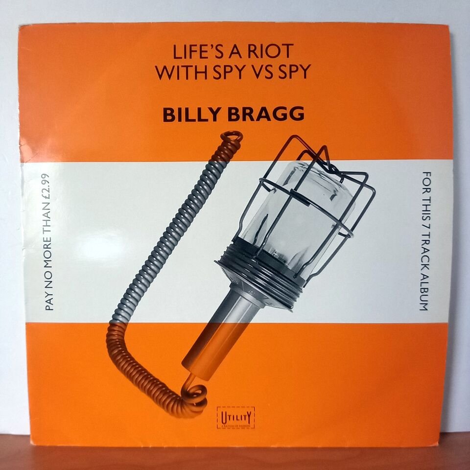 BILLY BRAGG – LIFE\'S A RIOT WITH SPY VS SPY (1983) - LP 2.EL PLAK