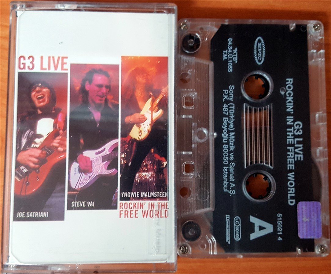 G3 LIVE - ROCKIN' IN THE FREE WORLD JOE SATRIANI STEVE VAI YNGWIE MALMSTEEN (2004) SONY CASSETTE MADE IN TURKEY ''USED''
