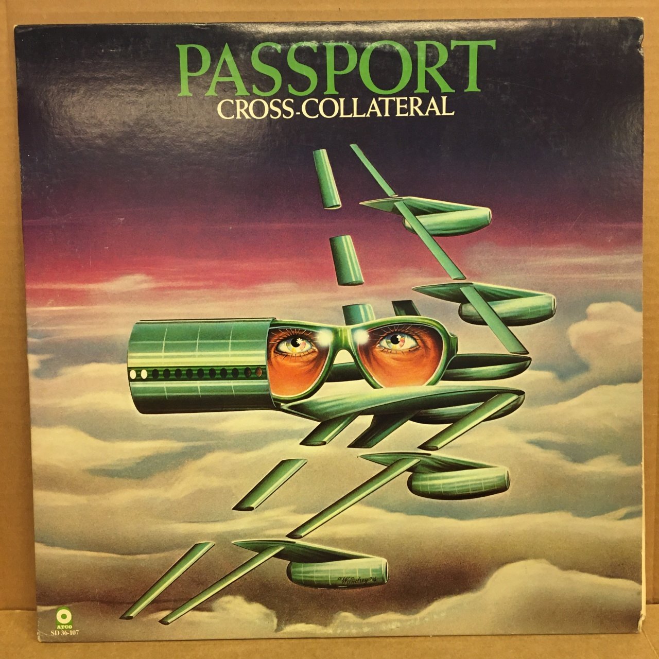 PASSPORT - CROSS-COLLATERAL 1975 2.EL PLAK