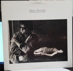 PAUL YOUNG - BETWEEN TWO FIRES (1986) - 2.EL PLAK