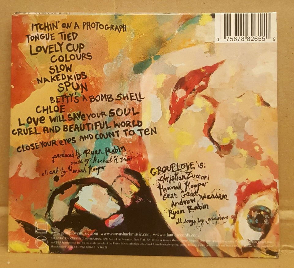 GROUPLOVE - NEVER TRUST A HAPPY SONG (2011) - CD INDIE ROCK DIGIPACK 2.EL