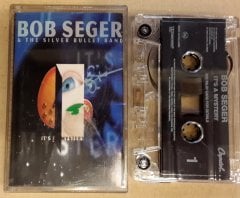BOB SEGER & THE SILVER BULLET BAND -  IT'S A MYSTERY CASSETTE 1995 MADE IN HOLLAND ''USED''